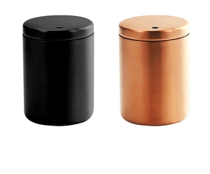 Detail view of black matte and bronze brushed stainless steel toothpick dispensers
