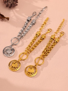 Detail of 18K gold and silver plated bracelets with rooster coin pendants and OT clasp