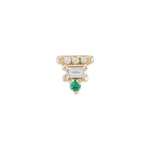 Macro detail of a 925 silver gold-plated piercing stud with green and white gems