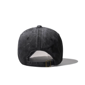Detail of adjustable metal buckle and vintage washed cotton texture on back of baseball cap