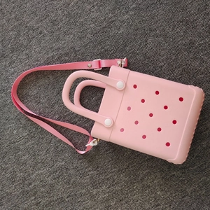 Pink cartoon EVA crossbody bag with adjustable wide strap and unique hole design