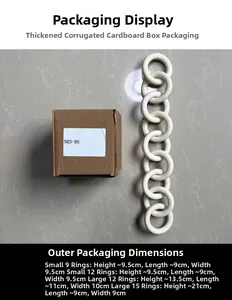 Detail view of a white ceramic chain wall hanging next to its brown packaging box
