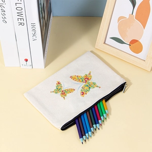 Canvas stationery pouch with floral butterfly prints shown holding colorful pencils