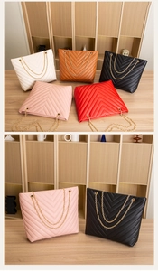 Detailed view of quilted chain bags in various colors including white, brown, black, pink and red