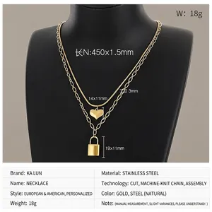 Close-up of double-layer stainless steel gold necklace with heart and padlock pendants