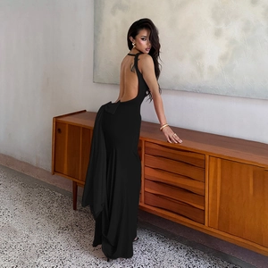 Detail of elegant black backless evening dress with a large bow tie on the back