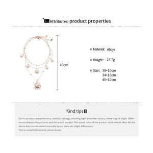 Detail showing dimensions and material of triple-layered sun pendant gold necklace