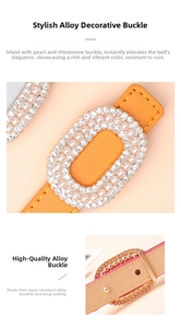 Detail of elegant orange leather belt featuring a gold buckle with pearls and rhinestones