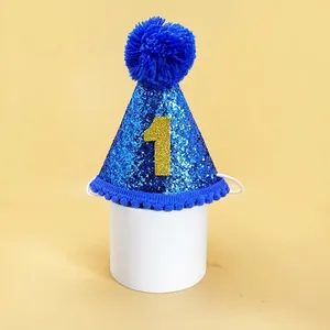Blue sequin first birthday party hat for dogs with golden number 1 and pom-pom detail