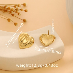 Detailed view of gold heart earrings with vertical pleat texture and size specifications