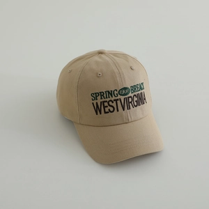 Close-up of vintage WESTVIRGINIA and SPRING 1986 embroidery on beige cotton baseball cap