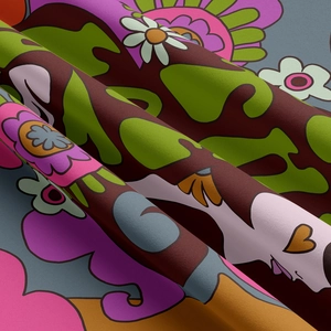 Detail of retro pop-style tapestry fabric with vibrant floral patterns and textile texture