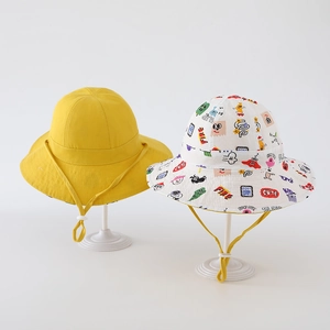 Detail of kids bucket hat with colorful cartoon prints and adjustable yellow chin strap