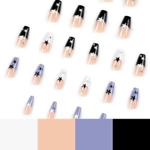 French coffin press-on nails in black, purple, and white with stars and rhinestones