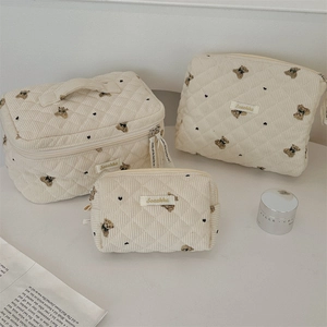 Three-piece retro bear cosmetic bag set in cream quilted corduroy with top handles