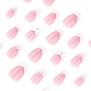 French almond press-on nails with pale pink base, white tips, pearls and 3D bows