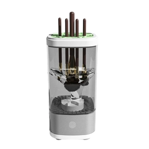 Macro view of automatic makeup brush cleaner with green holder and MAX water line