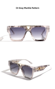 Detail of grey marble sunglasses with purple gradient lenses and gold heart decor