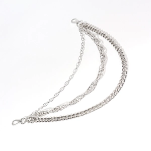 Close-up of triple-layered silver metal pants chain with heavy industrial cuban links