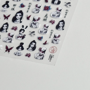 Macro detail of Japanese dark style nail stickers featuring fox scholar and rabbit demon