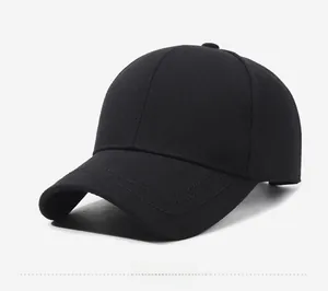 Detail of black cotton baseball cap showing metallic JB logo and twill texture