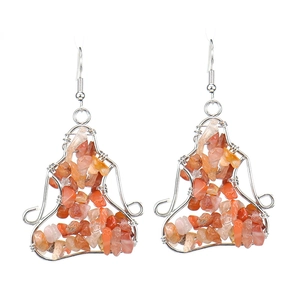 Detail showing handmade silver wire wrap earrings with natural red crystal stones