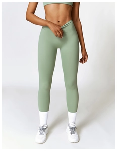 Detailed view of high-waist yoga pants featuring a unique V-shaped crossover waistband