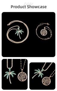 Detail shot of gold-plated palm tree and tree of life pendants with green zircons