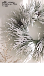 Detail of frosted PE leaves and large natural pinecones on a Nordic Christmas wreath