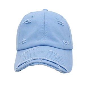 Close-up of sky blue distressed cotton baseball cap with vintage frayed hole details