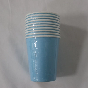 Blue disposable paper cups stack wrapped in transparent plastic film for party supplies