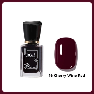 Detail of 14ml cherry wine red nail polish bottle with glossy finish color swatch