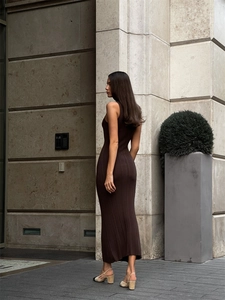 Detail of slim fit dark brown sleeveless knitted dress with fine ribbed texture texture