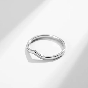 Minimalist silver V-shaped stainless steel ring with a modern geometric design