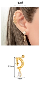 Detail view of a gold flower moon stud earring with dimensions 1.78cm x 0.8cm and zircons
