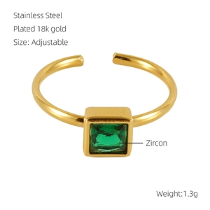 Detail of 18k gold plated stainless steel ring with a green square zircon stone