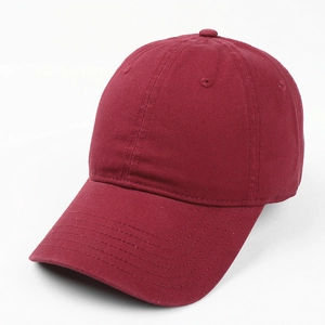 Detailed close-up of the burgundy washed cotton twill fabric on a solid baseball cap