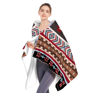 Detail of tribal geometric pattern on hooded microfiber beach towel with white lining