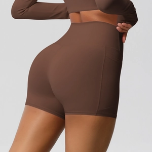 Detail view of high waist yoga shorts featuring side pockets and butt-lifting seam design
