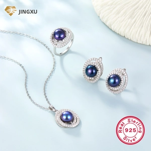Macro view of S925 sterling silver jewelry set with purple pearls and pavé zircons