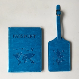 Blue PU leather world map passport cover and luggage tag set on white background