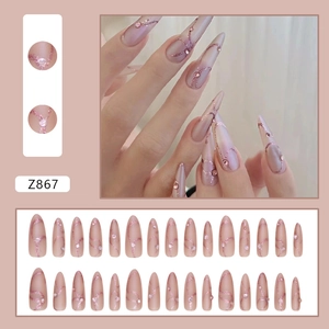 Nude pink almond press-on nails with glitter wave patterns and small rhinestones