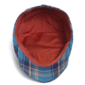Plaid duckbill flat cap with vintage blue check pattern and orange lining interior view