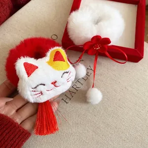 Plush Lucky Cat hair tie with red tassel and white flower pompom scrunchie set