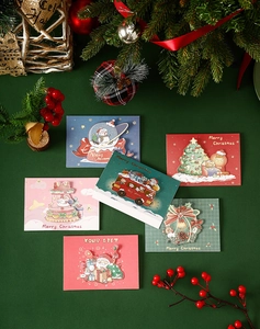 Detail of 3D Christmas cards with Santa and reindeer designs on a festive backdrop