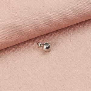 Macro view of silver stainless steel slider bead with silicone insert for DIY jewelry