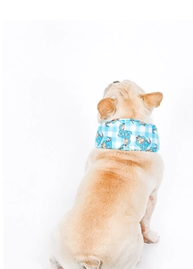 Close-up of blue dinosaur pattern cooling scarf on a French Bulldog's neck
