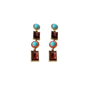Vintage jewelry set with gold tassel earrings featuring turquoise and ruby red gemstones