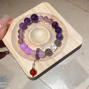 Elegant multi-color agate and amethyst beaded bracelet with a red round ball pendant