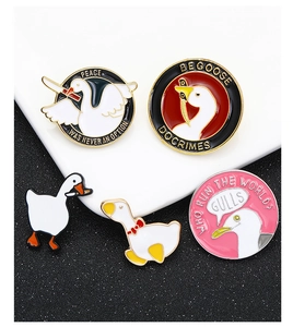 Macro shot of 5-piece funny goose enamel pins set with Peace Was Never An Option text